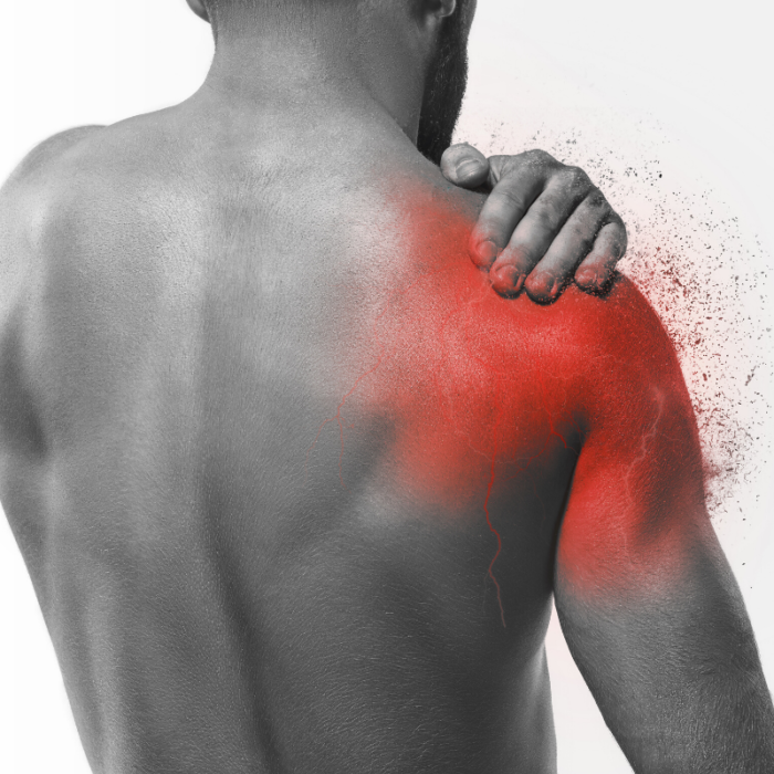 Man holding his aching shoulder.